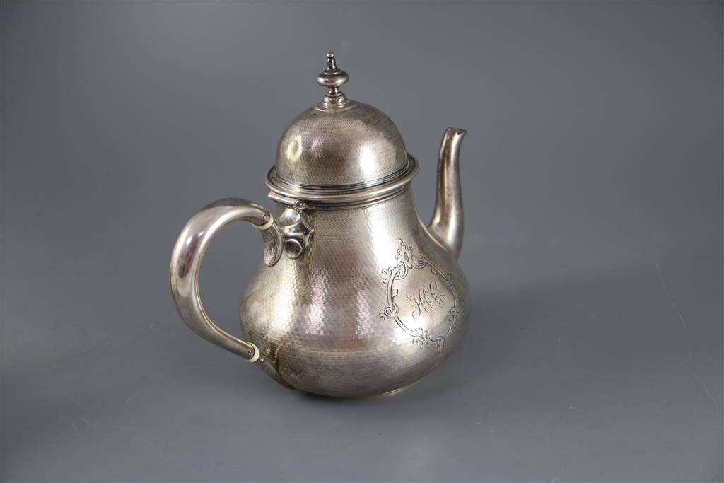 A Victorian engine turned silver three piece tea set by Richards & Brown,